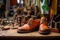hand-stitched leather shoes on workshop bench