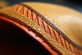 hand-stitching detail on a custom-made hat brim