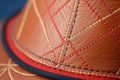 hand-stitching detail on a custom-made hat brim