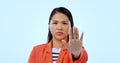 Hand, stop sign and portrait of woman in a studio with mad, upset and angry facial expression. Activism, protest and