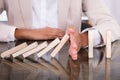 Hand Stopping Wooden Blocks From Falling Royalty Free Stock Photo