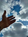 a hand stretched towards the sky Royalty Free Stock Photo