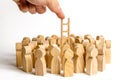 The hand stretches the ladder to a group of human figures. career ladder. Promotion at work, business, self-development