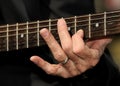 Hand strumming guitar strings