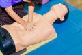 Hand student Heart pump with medical dummy on CPR, in emergency refresher training to assist of physician