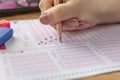 Hand student testing in exercise and taking fill in exam carbon paper computer sheet with pencil at school test room, education Royalty Free Stock Photo