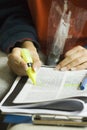 Hand, study highlight and student with a textbook closeup in a home for education, learning or growth. Paper, writing