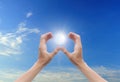 Hand sun and blue sky Royalty Free Stock Photo