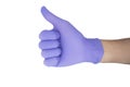 Hand of surgeon with a blue medical glove showing Ok sign, isolated on a white background
