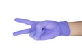 Hand of surgeon with a blue medical glove showing victory sign, isolated on a white background