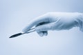 Hand of surgeon with scalpel Royalty Free Stock Photo