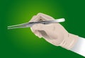 Hand of surgeon with surgical clamp Royalty Free Stock Photo