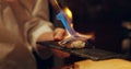 Hand, sushi and fire with chef in kitchen of restaurant for luxury or traditional cuisine closeup. Food, blow torch and Royalty Free Stock Photo