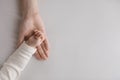 Hand of sweet few month baby resting in mothers palm Royalty Free Stock Photo