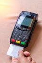 Hand Swiping Credit Card on POS terminal in Store Royalty Free Stock Photo