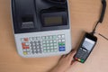 Hand Swiping Credit Card In a Store with cash register Royalty Free Stock Photo