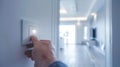 Hand switching on a light in a modern, well-lit interior. Concept of energy efficiency, smart home technology, and daily