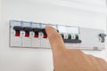 Hand Switching Off Electrical Circuit Breaker
