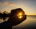 Hand symbol against sunlight