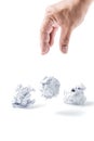 Hand taking a crumpled paper ball isolated Royalty Free Stock Photo