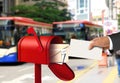 Hand taking a letter from a red postal box Royalty Free Stock Photo