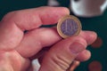 Hand taking one euro coin from broken piggy coin bank Royalty Free Stock Photo