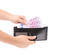 Hand taking out euro bills from purse. Royalty Free Stock Photo
