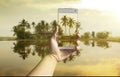 Hand taking photo of the fish village landscape