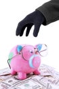 Hand taking piggy bank and money Royalty Free Stock Photo