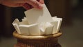 Hand Taking White Paper Slip From Decorative Container Royalty Free Stock Photo