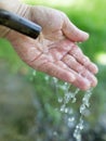Hand in tap water in nature Royalty Free Stock Photo