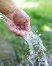 Hand in tap water in nature Royalty Free Stock Photo