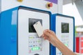 A hand tapping EV charging point card to reader machine. Unlock the station. Electric vehicles battery. Chargeable device or Royalty Free Stock Photo