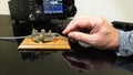 Hand tapping morse code on telegraph straight key. Royalty Free Stock Photo