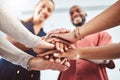 Hand, teamwork and motivation with a business team and their hands in a huddle while standing in a circle in the office Royalty Free Stock Photo