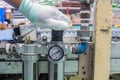 The hand of technician adjust the pressure setting of the wind on regulator. In the pneumatic system Royalty Free Stock Photo