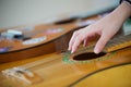 The hand of a teenage girl lying on the strings of a musical instrument guitar Royalty Free Stock Photo