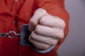 THE HAND OF A TEENAGER IN HANDCUFFS. Concept: juvenile delinquent, criminal liability of minors. Members of youth criminal groups Royalty Free Stock Photo