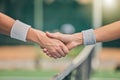 Hand, tennis and handshake for partnership, unity or greeting in sportsmanship at the outdoor court. Players shaking Royalty Free Stock Photo