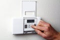 Hand on Thermostat Royalty Free Stock Photo