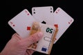 Hand with three aces and one money bet Royalty Free Stock Photo