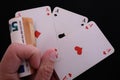 Hand with three aces and one money bet Royalty Free Stock Photo