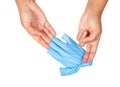 Hand throwing away blue disposable gloves. Royalty Free Stock Photo