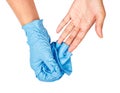 Hand throwing away blue disposable gloves. Royalty Free Stock Photo