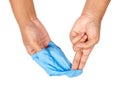 Hand throwing away blue disposable gloves. Royalty Free Stock Photo