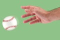 A hand throwing a baseball Royalty Free Stock Photo