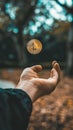 Hand throwing decentralized bitcoin cryptocurrency into the air Royalty Free Stock Photo