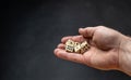 Hand throwing dice in front of a dark background Royalty Free Stock Photo