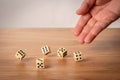 Hand throwing dice in front of a dark background Royalty Free Stock Photo