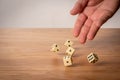 Hand throwing dice in front of a dark background Royalty Free Stock Photo